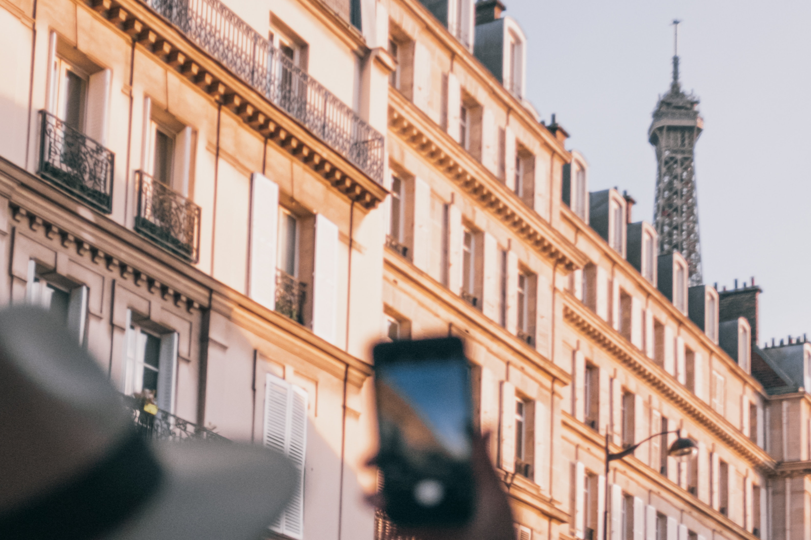 A person using a smartphone in Paris