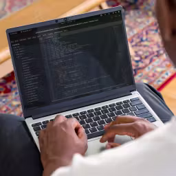 Photo of a person typing on a Framework Laptop 13