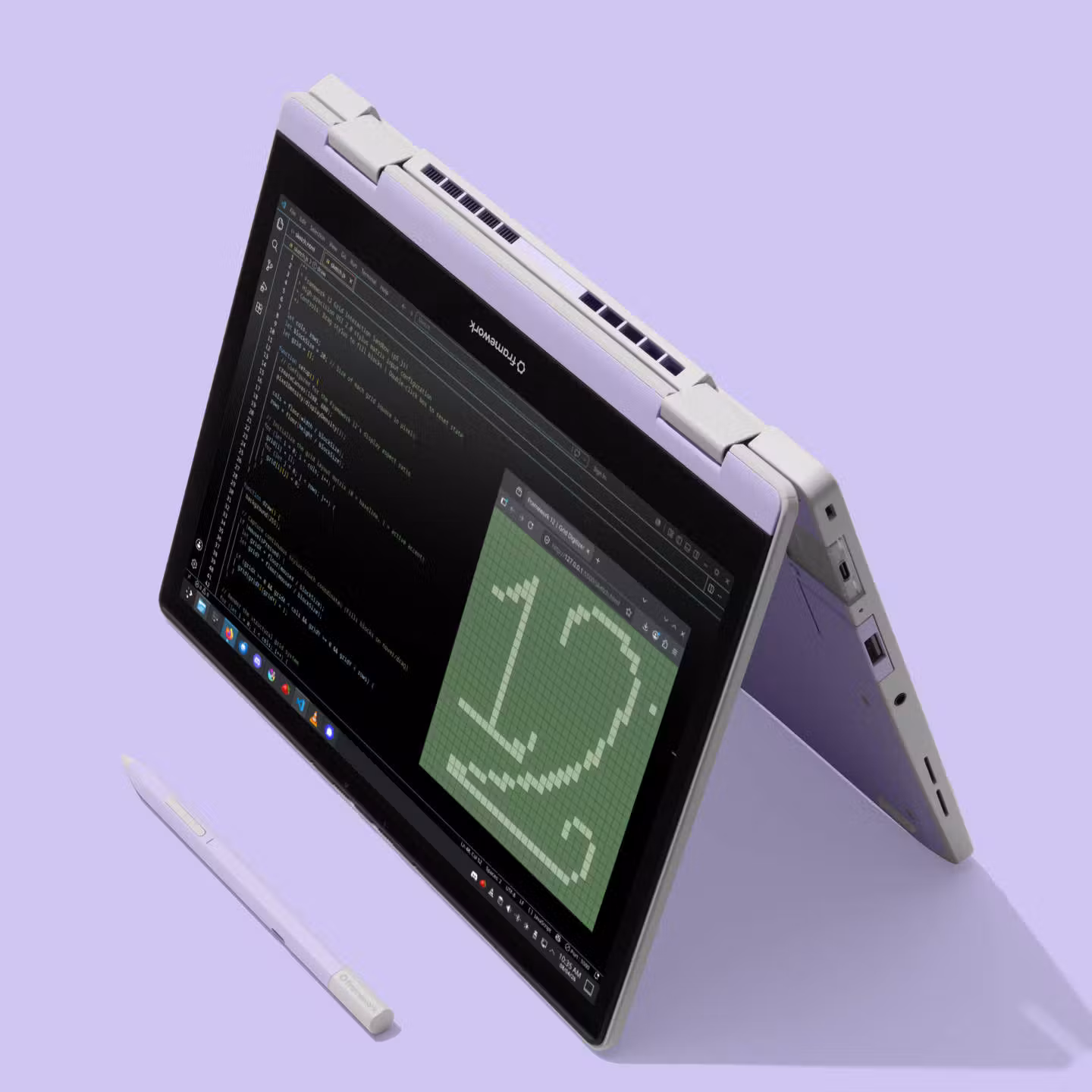 A Lavender colorway Framework Laptop 12 tilted at an angle in tablet-tent mode, showing a code editor, with a matching lavender stylus resting beside it on a light purple background.