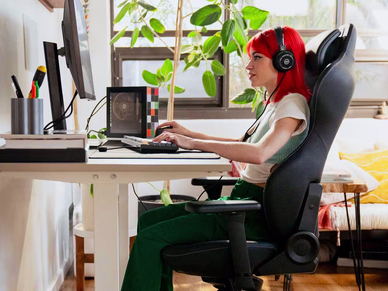 Image of person at their desk with a Framework Desktop