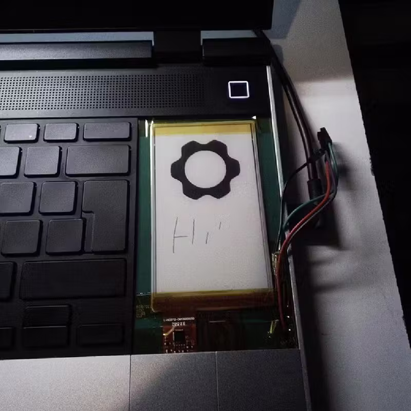 Close-up shot of an E-Ink module prototype for Framework Laptop 16.