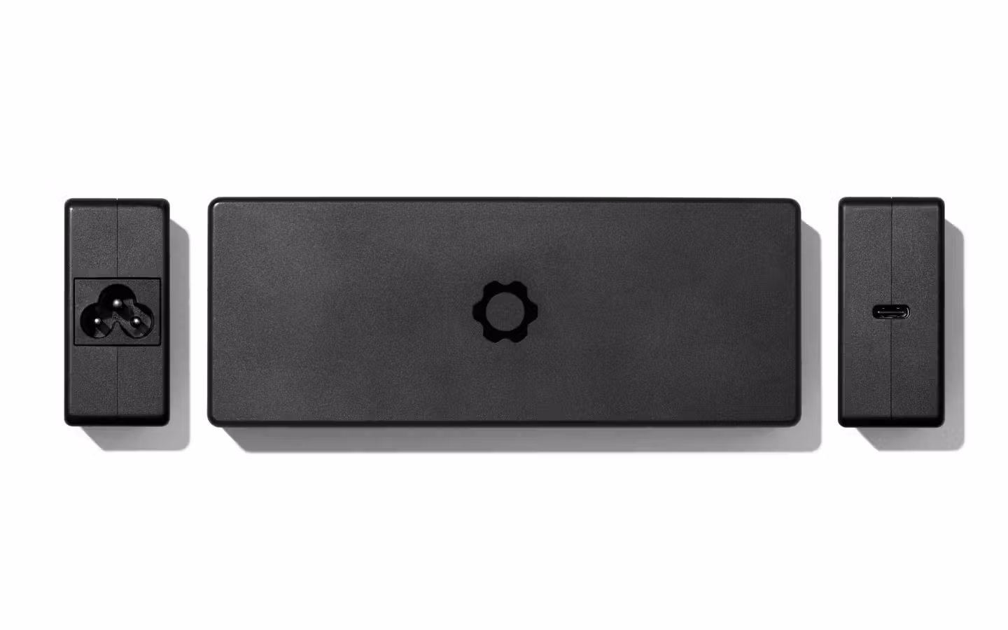 Top-down studio shot of a 240W USB-C power adapter.