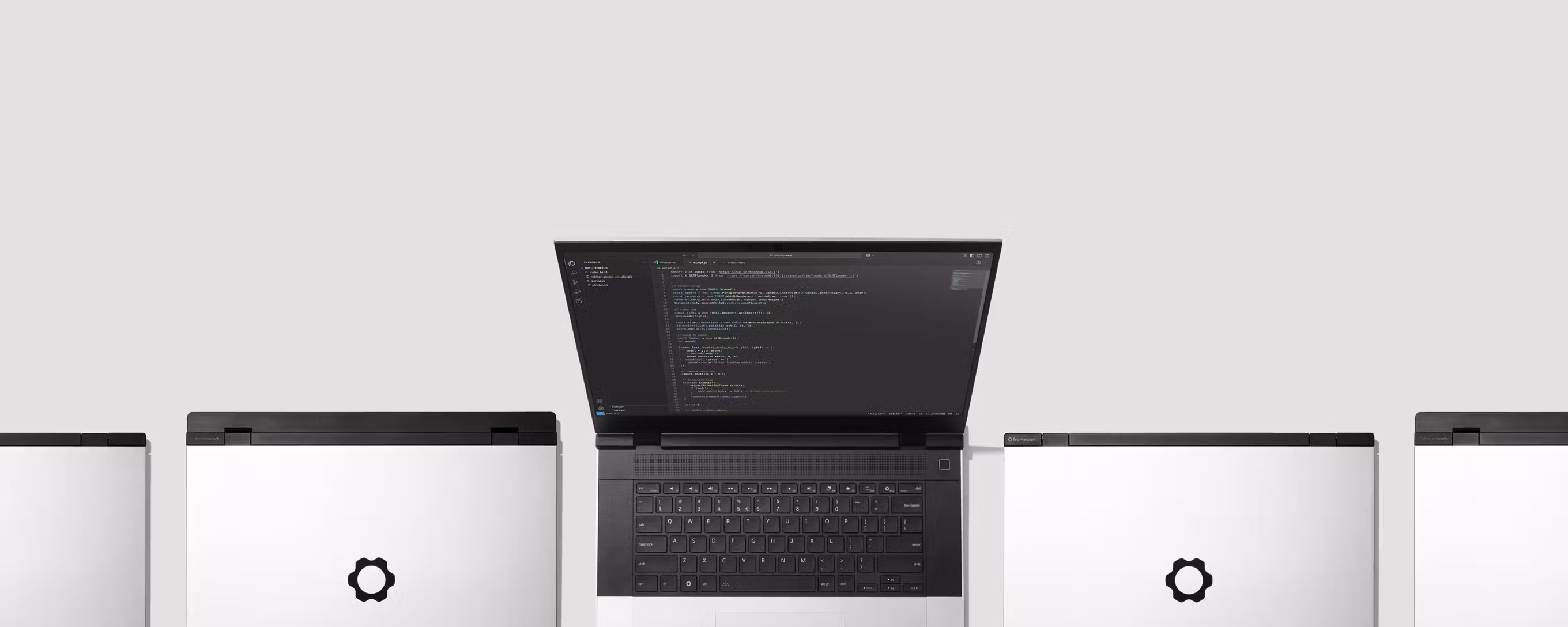 Top-down studio shot of multiple Framework Laptops 16s.