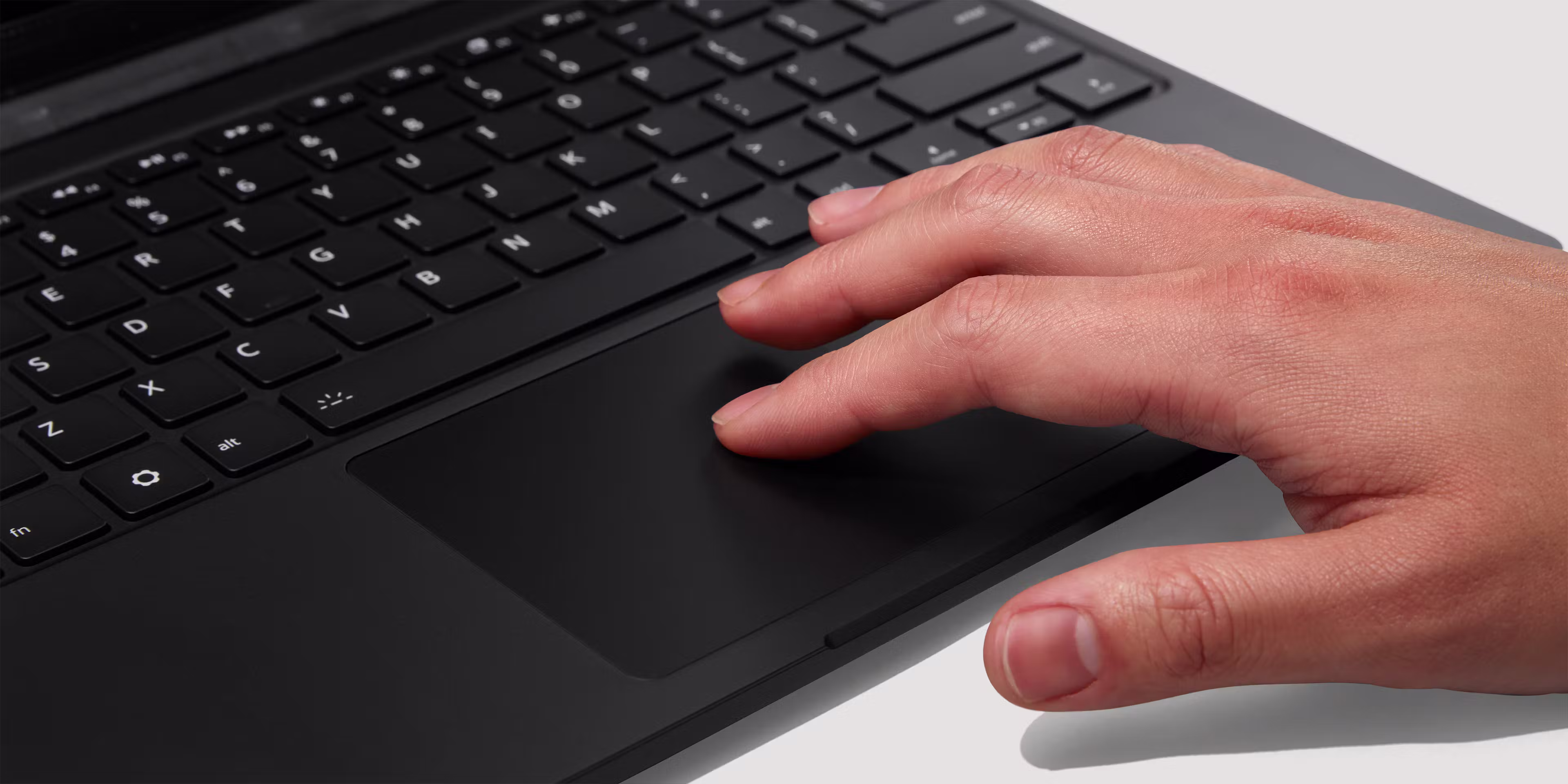 A tight close-up of a Framework Laptop 13 Pro Haptic Touchpad in use