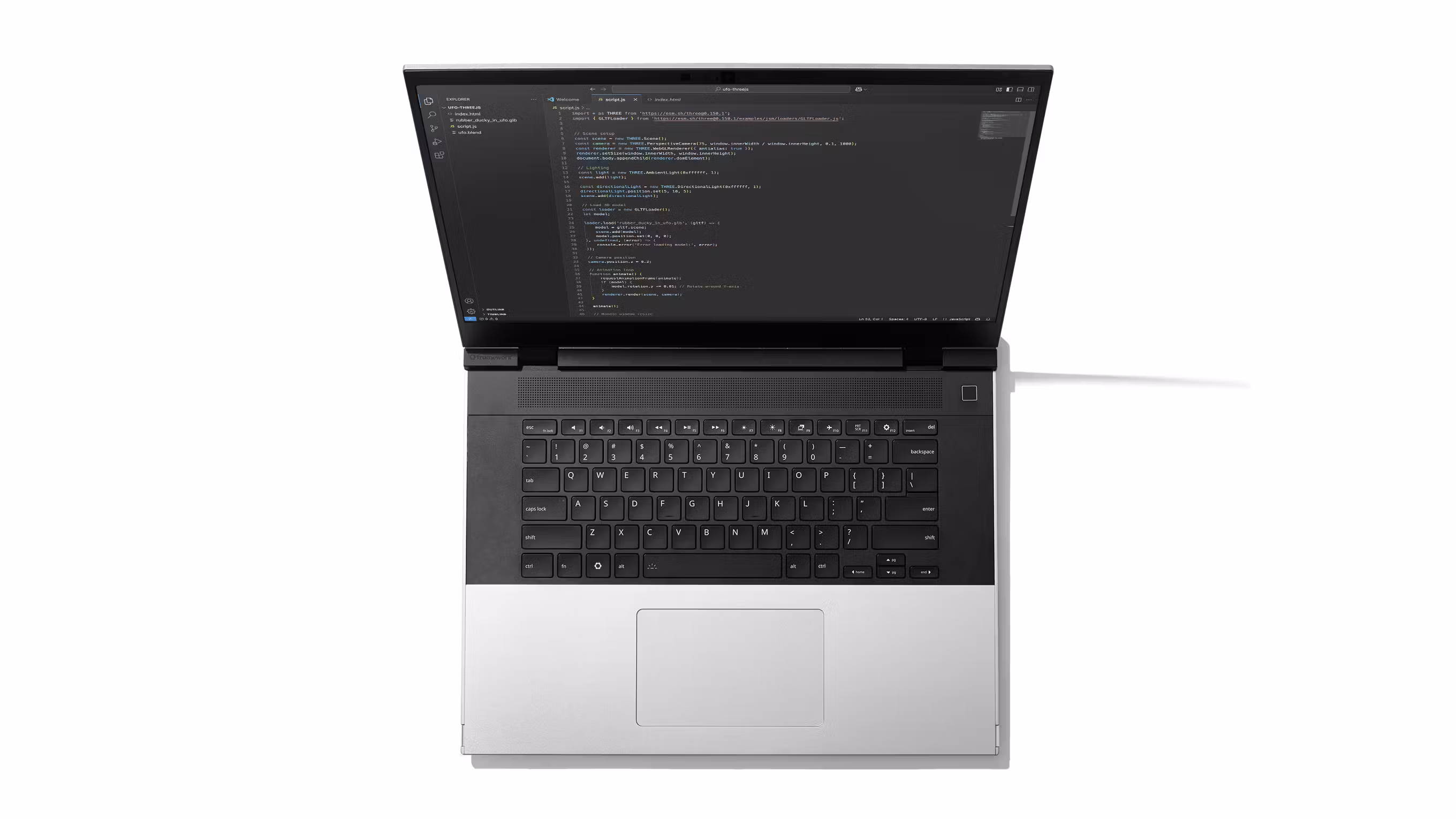 A top-down studio shot of Framework Laptop 16 showcasing the new one piece keyboard and one piece haptic touchpad. 