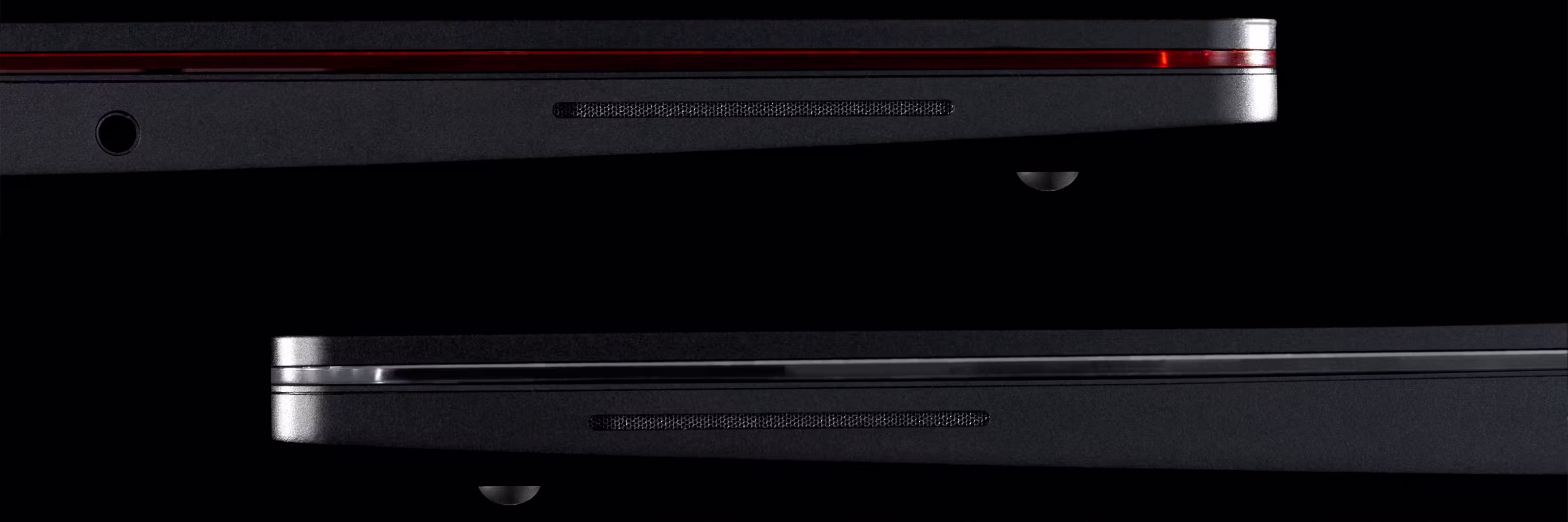 A side angle shot of two 13 Pro Laptops focussing on the side firing speakers.