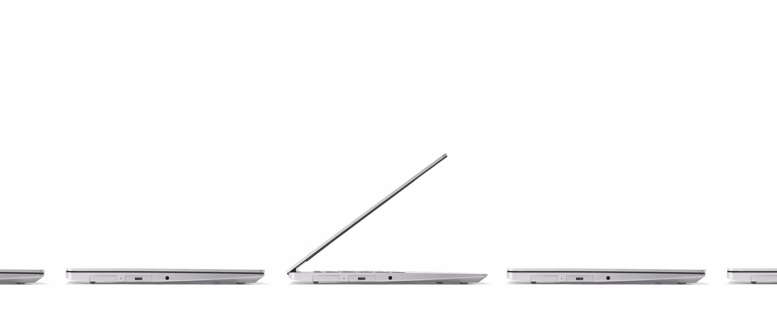 Side angle studio shot of multiple Framework Laptops 13s.